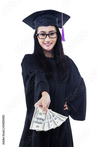 Photo: Asian female graduate holding money - isolated Asian female graduate holding money - isolated