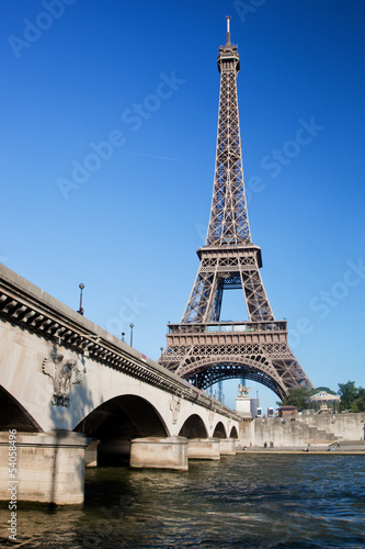 Photo: Eiffel Tower and bridge on Seine river in Paris, France. Eiffel Tower and bridge on Seine river in Paris, France.