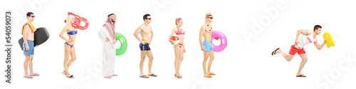 Photo: Full length portrait of young people with summer objects Full length portrait of young people with summer objects
