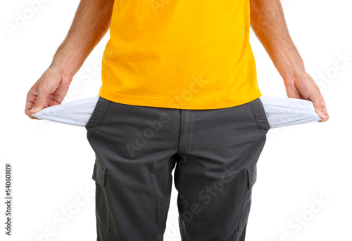 Photo: Man showing his empty pockets, isolated on white Man showing his empty pockets, isolated on white