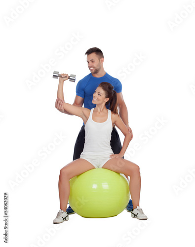 Photo: Attractive woman and a personal trainer Attractive woman and a personal trainer