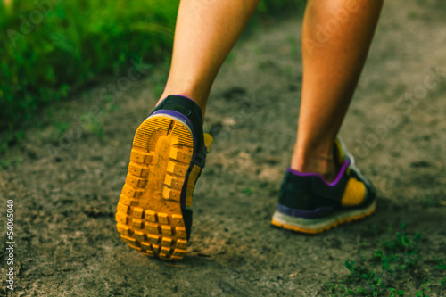 Photo: sports shoes large female legs running, exercising and walking,f sports shoes large female legs running, exercising and walking,f