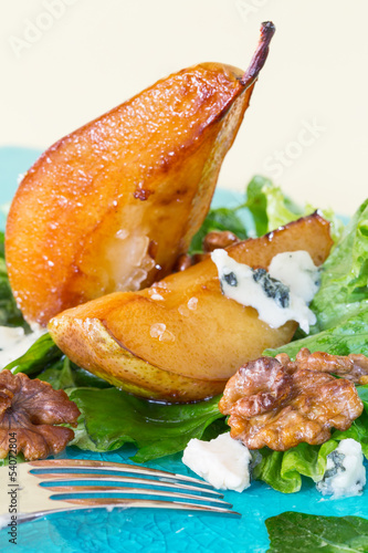 Photo: Salad with caramelised pears,walnuts and blue cheese, vertical Salad with caramelised pears,walnuts and blue cheese, vertical