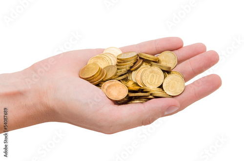 Photo: A handful of gold coins on the palm of your hand A handful of gold coins on the palm of your hand