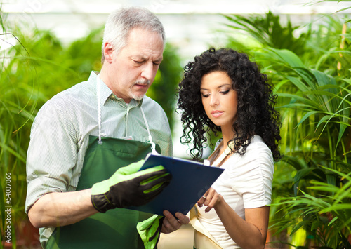 Photo: Greenhouse workers Greenhouse workers