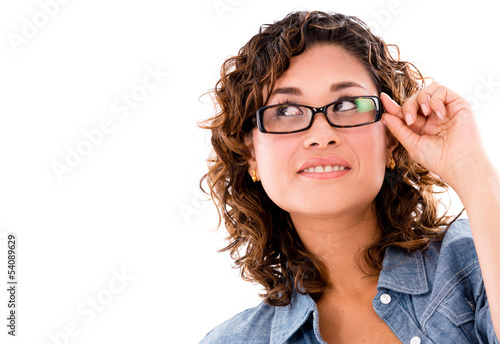 Photo: Thoughtful woman wearing glasses Thoughtful woman wearing glasses