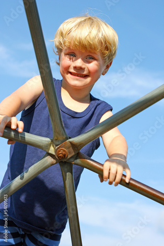 Photo: Child Climbing Jungle Gym Child Climbing Jungle Gym