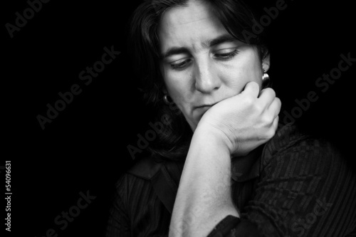 Photo: Black and white portrait of a depressed hispanic woman Black and white portrait of a depressed hispanic woman