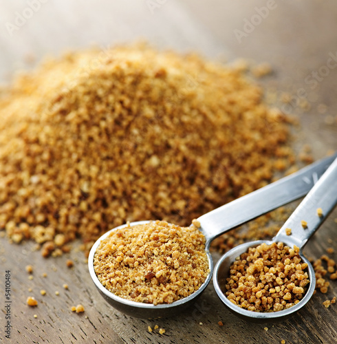 Photo: Coconut palm sugar in measuring spoons Coconut palm sugar in measuring spoons