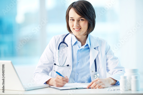 Photo: Writing a prescription Writing a prescription