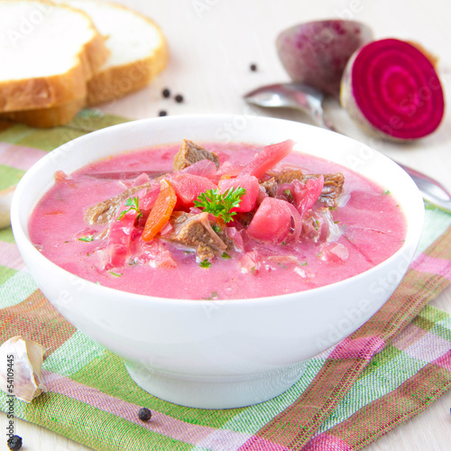 Photo: Traditional Russian borsch soup with beef, beet and sour cream Traditional Russian borsch soup with beef, beet and sour cream