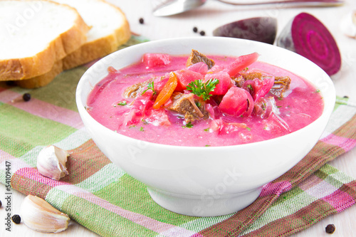 Photo: Traditional Russian borsch soup with beef, beet and sour cream Traditional Russian borsch soup with beef, beet and sour cream
