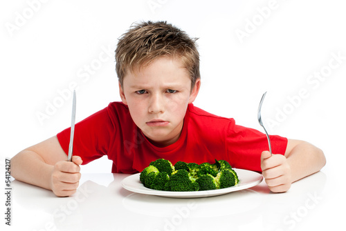Photo: Handsome Young Boy Eating Broccoli Handsome Young Boy Eating Broccoli