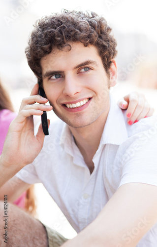 Photo: Young guy with mobile phone Young guy with mobile phone