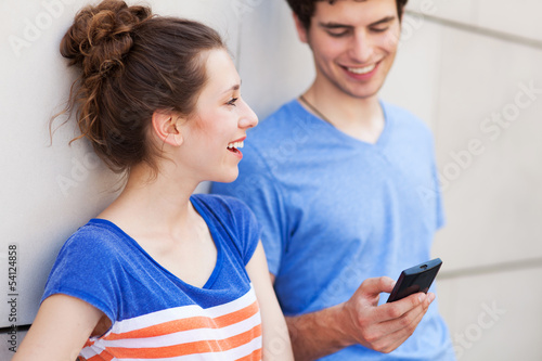 Photo: Young people with mobile phone Young people with mobile phone