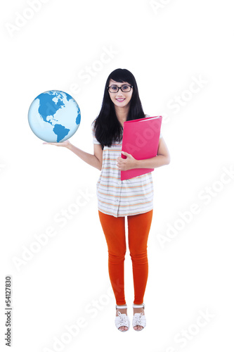 Photo: College student holding globe and folder College student holding globe and folder