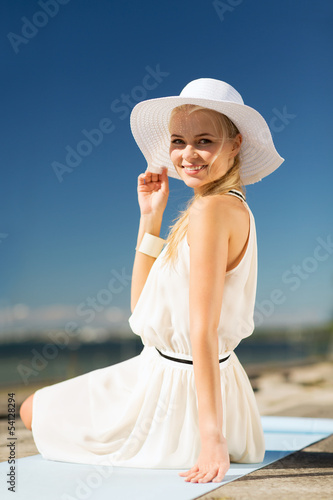 Photo: beautiful woman enjoying summer outdoors beautiful woman enjoying summer outdoors