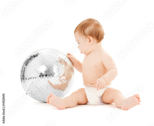 Photo: child playing with disco ball child playing with disco ball