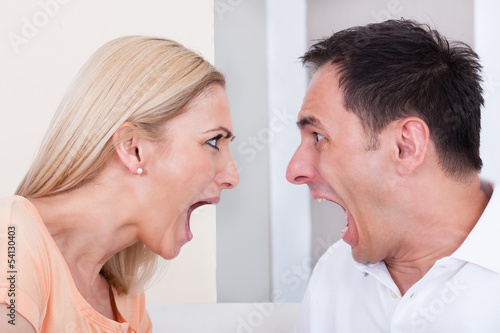 Photo: Angry couple shouting at each other Angry couple shouting at each other
