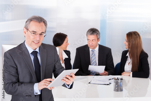 Photo: Businessman Using Digital Tablet Businessman Using Digital Tablet