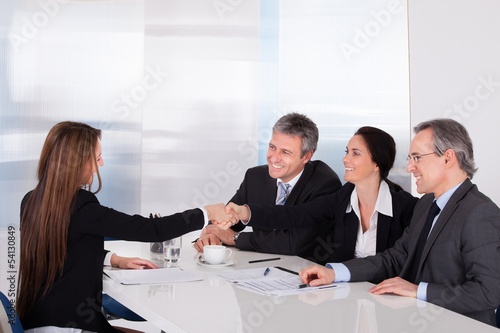 Photo: Two Businesswomen Shaking Hand Two Businesswomen Shaking Hand