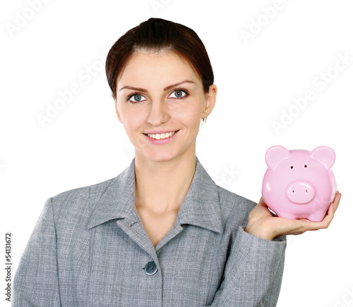 Photo: Young beautiful woman standing with piggy bank (money box) Young beautiful woman standing with piggy bank (money box)