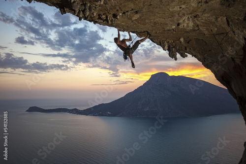  Male rock climber at sunset. Kalymnos Island, Greece