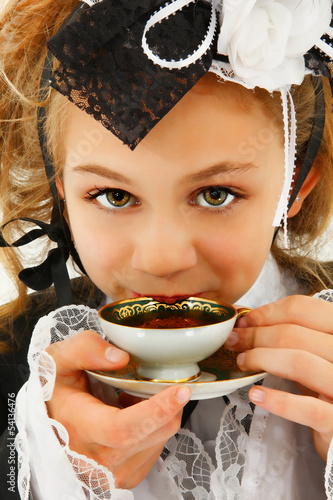Photo: Beautiful Tween Girl in Cosplay Fashion Sipping Tea Beautiful Tween Girl in Cosplay Fashion Sipping Tea