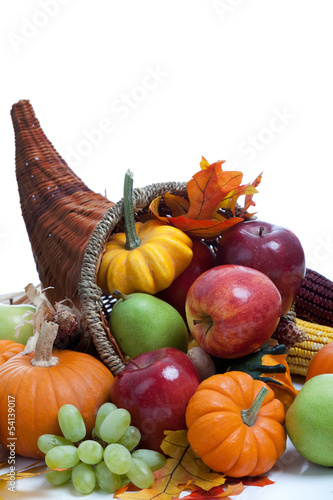 Photo: An overflowing cornucopia on a white background An overflowing cornucopia on a white background