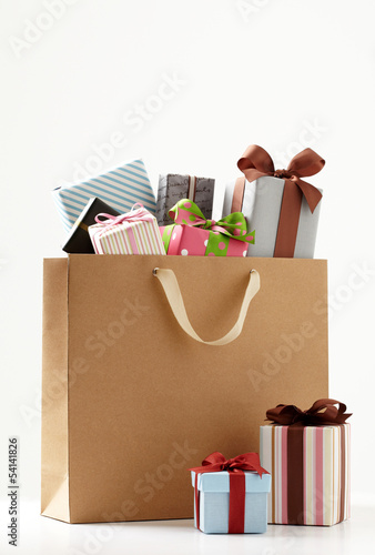 Photo: shopping bag with cute Gift box of white background. shopping bag with cute Gift box of white background.