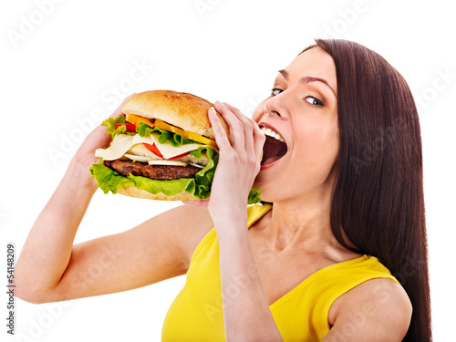 Photo: Woman holding hamburger. Woman holding hamburger.