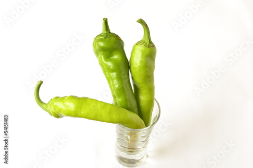 Photo: Chili green peppers on a white background Chili green peppers on a white background