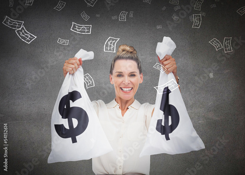 Photo: Businesswoman holding cash bags Businesswoman holding cash bags