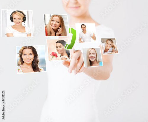 Photo: woman with virtual screen and contact icons woman with virtual screen and contact icons