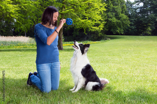 Photo: Playing fetch with her dog Playing fetch with her dog
