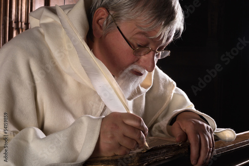 Photo: Ancient book and monk Ancient book and monk