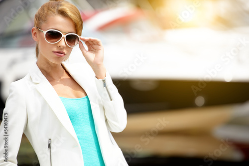 Photo: Outdoor portrait of a beautiful summer woman Outdoor portrait of a beautiful summer woman