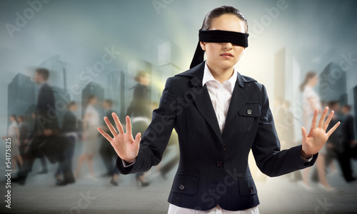 Photo: young blindfolded woman young blindfolded woman