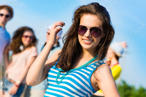Photo: stylish young woman in sunglasses stylish young woman in sunglasses