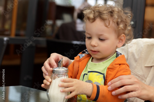 Photo: Toddler holding sugar bowl Toddler holding sugar bowl