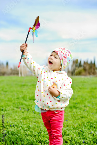 Photo: hapy girl with windmill hapy girl with windmill