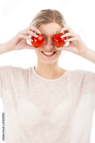 Photo: Beaitiful woman with tomatos in front of the face Beaitiful woman with tomatos in front of the face
