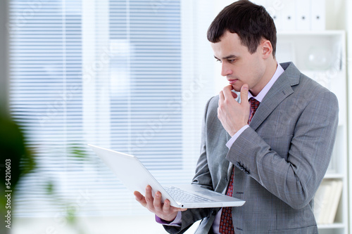 Photo: man in office man in office