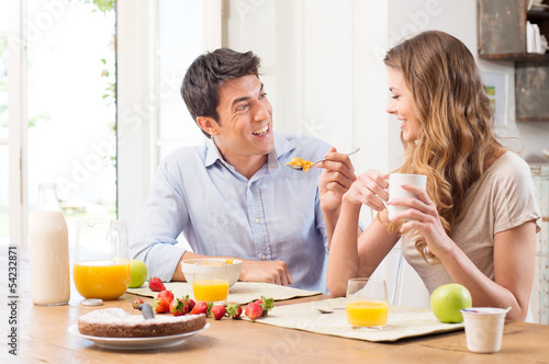 Photo: Young Couple Having Breakfast Young Couple Having Breakfast