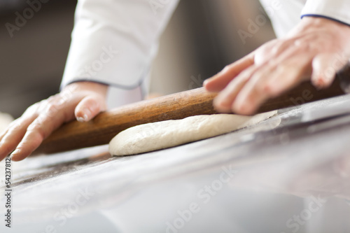 Photo: Chef preparing dough in the kitchen Chef preparing dough in the kitchen