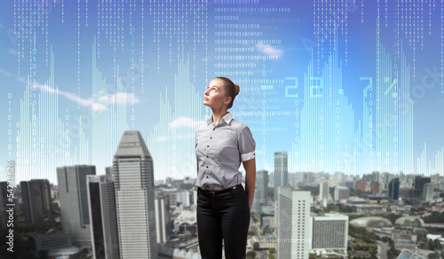 Photo: Business person with digital symbols Business person with digital symbols