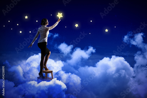 Photo: Woman lighting stars Woman lighting stars