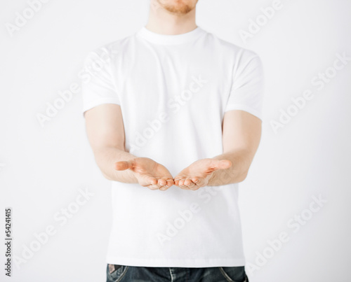 Photo: mans hands showing something mans hands showing something