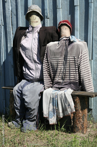 Photo: Two effigies near a shed Two effigies near a shed