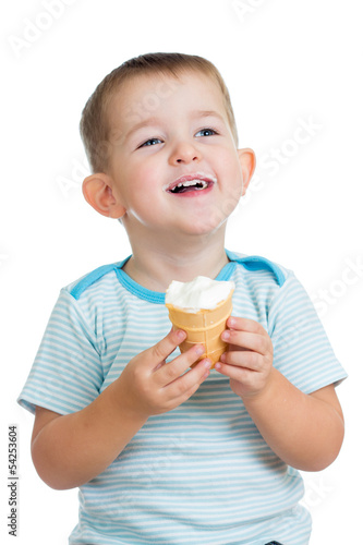 Photo: smiling kid boy eating ice cream in studio smiling kid boy eating ice cream in studio